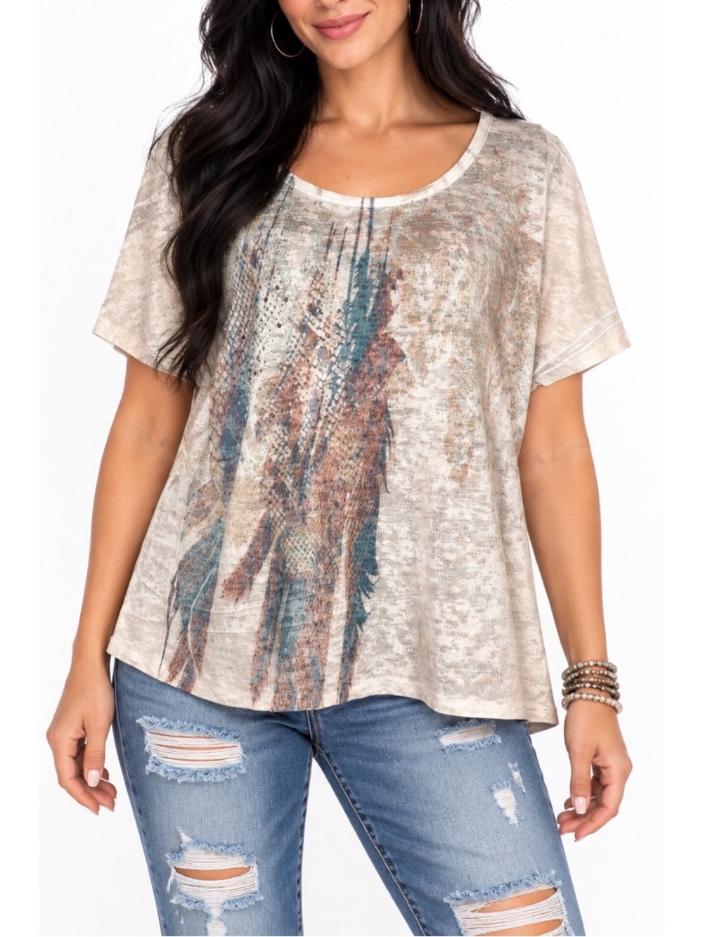 Maurice’s short-sleeve top features a soft beige/cream background